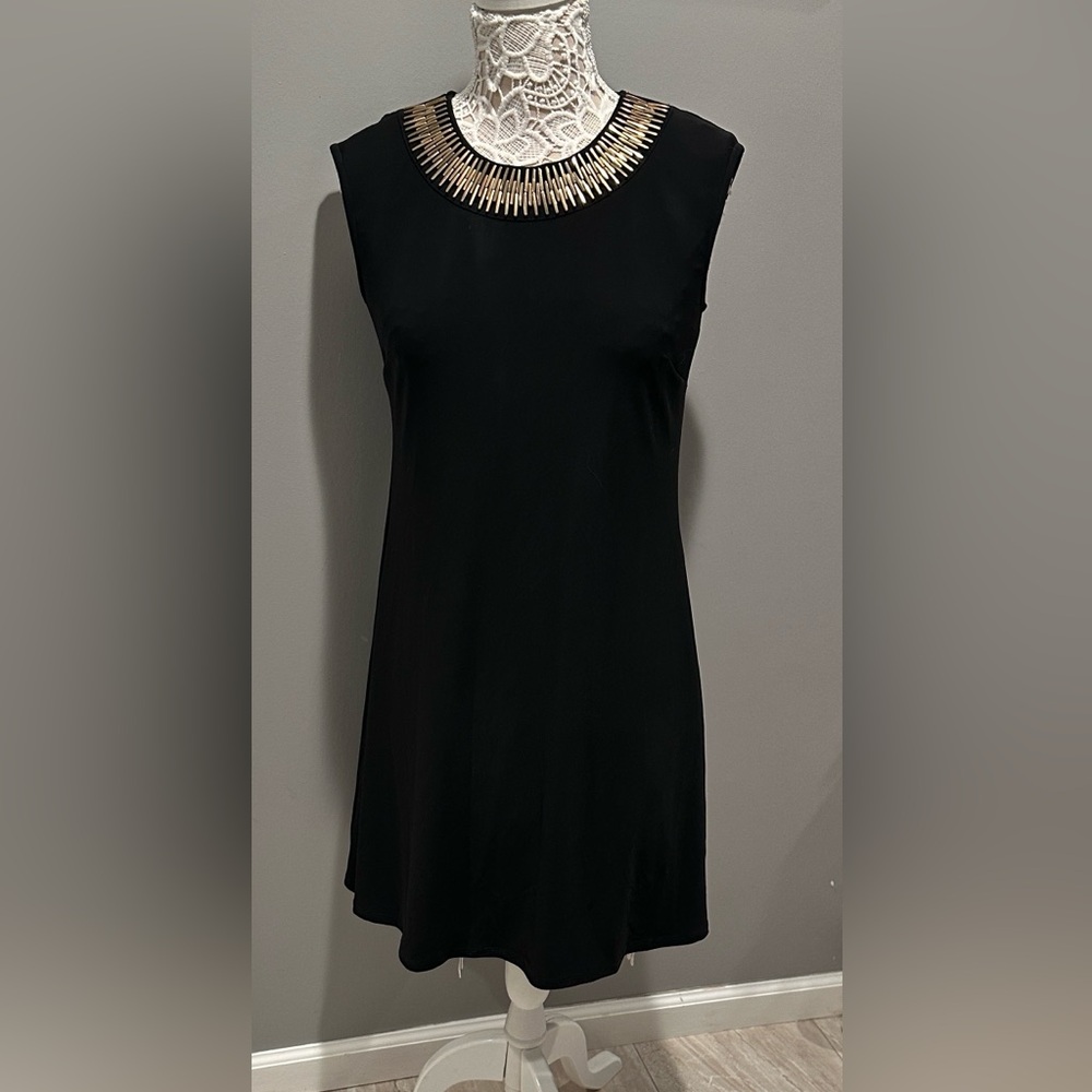 Brand new Chic Black Dress with Gold Detailing